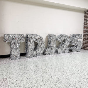 Decorative metallic tinsel letters in marquee style