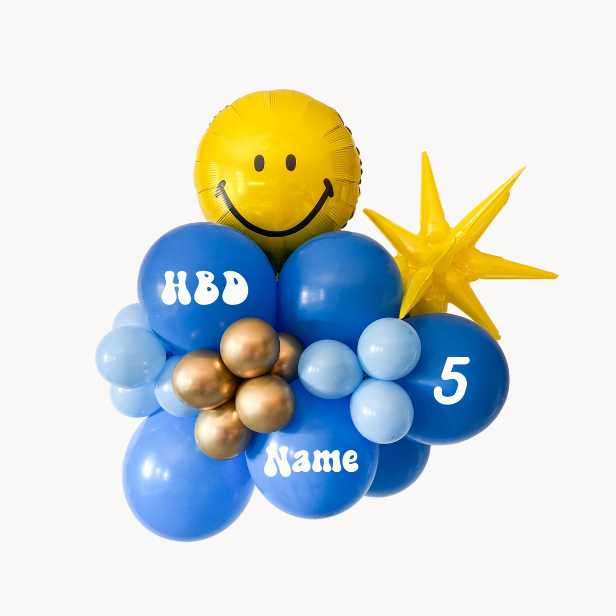 Balloon arrangement with blue, gold, and yellow balloons on a white background