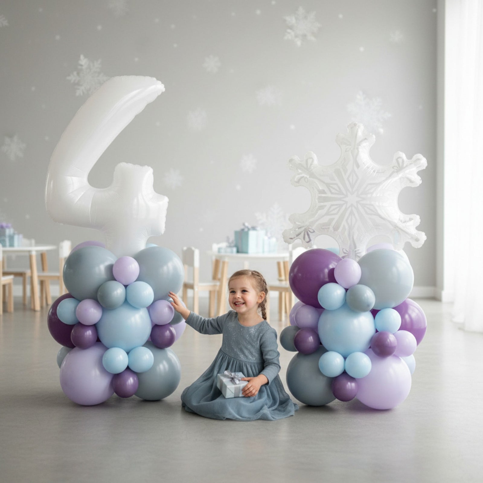 Decorative balloon sculptures shaped like a number '4' and a snowflake on a white background