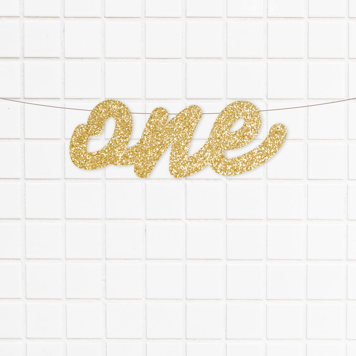 gold glitter cardstock and features a lovely script font. It is perfect for your little one's first birthday party and cake smash photos.