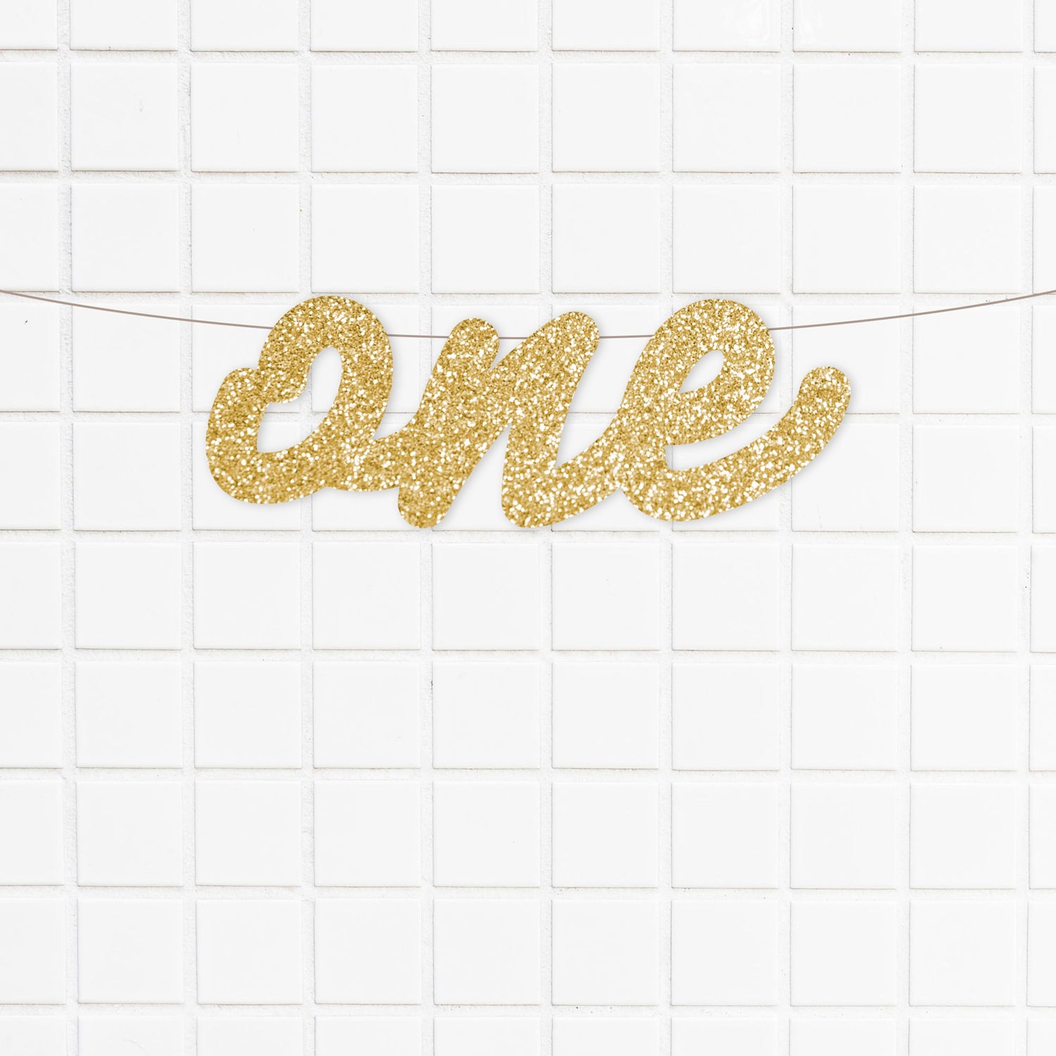 gold glitter cardstock and features a lovely script font. It is perfect for your little one's first birthday party and cake smash photos.